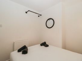 A bedroom with a bed and towels at Penny Farthing Inn Aston Crews near Ross-On-Wye