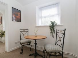 A dining area with a table and two chairs at Penny Farthing Inn Aston Crews near Ross-On-Wye