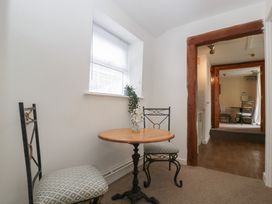 A hallway with a table and chairs at Penny Farthing Inn Aston Crews near Ross-On-Wye