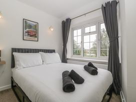 A bedroom with a bed and window at Penny Farthing Inn Aston Crews near Ross-On-Wye
