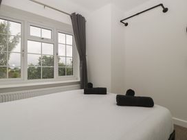 A bedroom with a bed and towels on it at Penny Farthing Inn Aston Crews near Ross-On-Wye