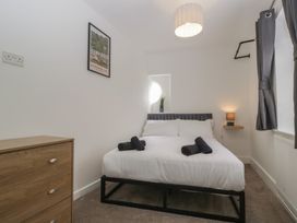 A bedroom with a bed and a dresser at Penny Farthing Inn Aston Crews near Ross-On-Wye