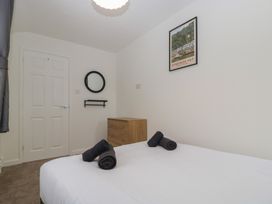 A bedroom with a bed, dresser, and mirror at Penny Farthing Inn Aston Crews near Ross-On-Wye