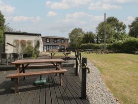 An outdoor area with tables and chairs at Penny Farthing Inn Aston Crews near Ross-On-Wye