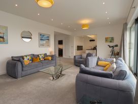 A living room with sofas and a coffee table at 70 Deganwy Road in Deganwy
