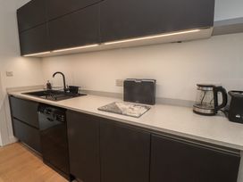 A kitchen with modern appliances and cabinetry at 70 Deganwy Road in Deganwy