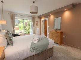 A bedroom with a bed and dresser at 70 Deganwy Road in Deganwy