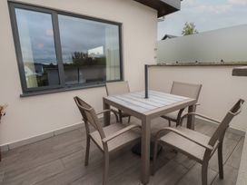 An outdoor seating area with a table and chairs at 70 Deganwy Road Deganwy