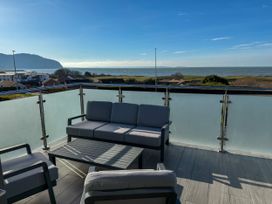 A balcony with seating and a view at 70 Deganwy Road in Deganwy
