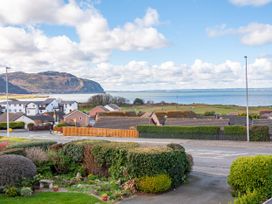 A view of houses and the sea at 70 Deganwy Road in Deganwy