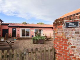 A games room with a patio area at Churn House Ipswich