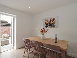 A dining room with a table and chairs at 3 The Stables Highbridge