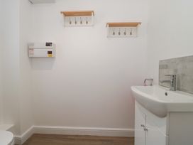 A bathroom with a sink and toilet at 3 The Stables in Highbridge