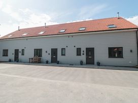 A building with multiple doors and windows at 3 The Stables Highbridge