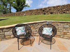 Two chairs with cushions in an outdoor area at Barley near Nelson