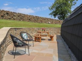 An outdoor area with a table and chairs at Black Moss in Nelson