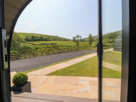A view from an open door of a garden pathway at Black Moss in Nelson