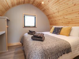 A bedroom with a bed and window at Black Moss in Nelson