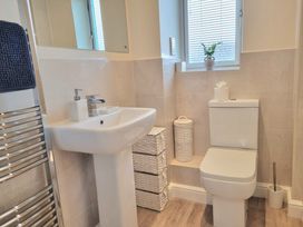 A bathroom with sink and toilet at Hafan Rhos in Rhos-On-Sea