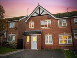 A house with brick exterior and front door at Hafan Rhos in Rhos-On-Sea