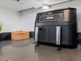 A Ninja air fryer on a countertop at Hafan Rhos in Rhos-On-Sea