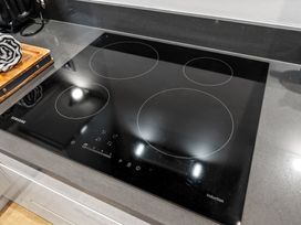 An induction cooktop on a kitchen countertop at Hafan Rhos, Rhos-On-Sea