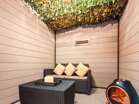 A lounge area with a sofa and coffee table at Hafan Rhos in Rhos-On-Sea