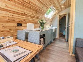 A kitchen with table and chairs at Ogden in Nelson