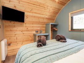 A bedroom with a bed and towels on top at Ogden in Nelson