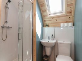 A bathroom with a shower, sink, and toilet at Ogden, Nelson