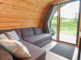 A living room with a sofa and view of the outdoors at Pendle in Nelson