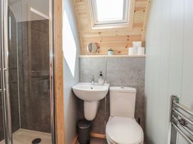 A bathroom with a shower, sink, and toilet at Pendle in Nelson