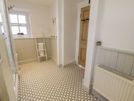 A bathroom with a shower and toilet at Bwthyn Morse in Llanfair