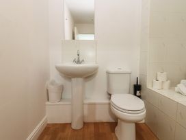 A bathroom with a sink and toilet at Curwen Apartment in Workington