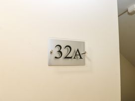 A room number sign displaying 32A