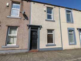 A building facade with windows and a front door at Bolton Terrace in Workington