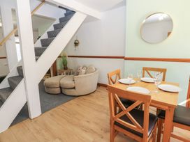 A dining room with a table and chairs at Bolton Terrace in Workington