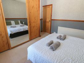A bedroom with a bed and towels on it at Bolton Terrace in Workington