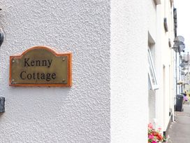 A sign with the name Kenny Cottage on a wall in Dawlish