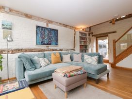 A living room with a sofa and artwork at The Art House Leominster