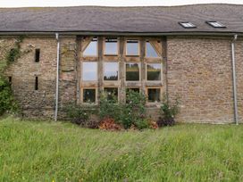 A building exterior with large windows and plants at The Art House Leominster