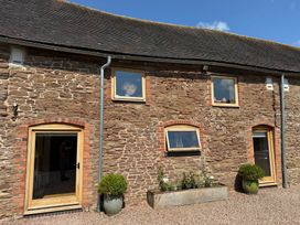 An exterior view of a building with stone walls and windows at The Art House in Stoke Prior