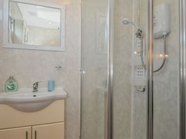 A bathroom with a sink and shower at 8 Hillside in Bude