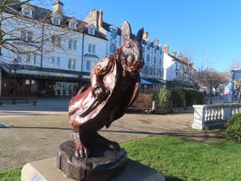 A rabbit statue wearing a coat in a park in Bryn Pydew near Llandudno Junction Skerry Vore