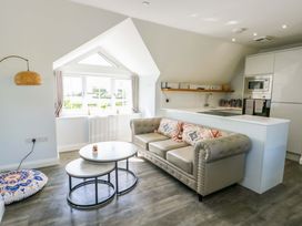 A living room with a sofa and coffee table at The Gatekeepers Cottage - Skerry Vore Bryn Pydew near Llandudno Junction
