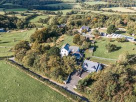 An aerial view of a property with a house and gardens at The Gatekeepers Cottage - Skerry Vore, Bryn Pydew near Llandudno Junction
