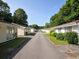 A view of bungalows along a road at 4 Rosecraddoc Lodge Holiday Bungalows in Liskeard