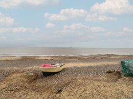 A boat on a beach with a net at No. 2 - Seaview in Kessingland