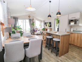 A dining room with a table and chairs at No. 2 - Seaview in Kessingland