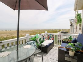 An outdoor seating area with chairs and a table at No. 2 - Seaview Kessingland